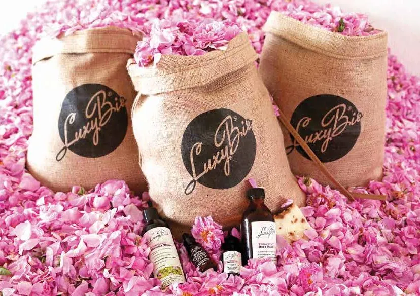 LuxyBio sacks of rose petals with LuxyBio products